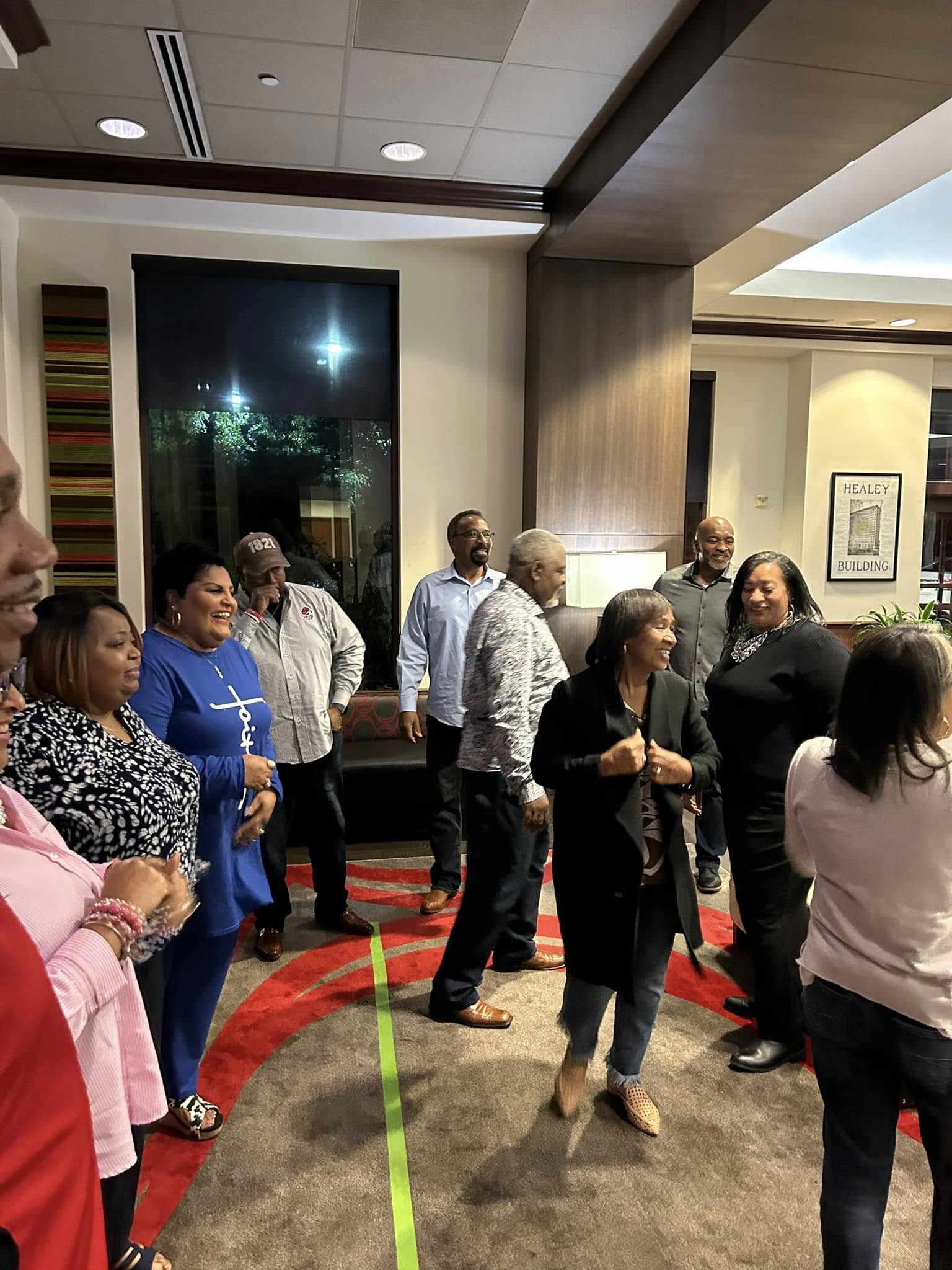 Retreat participants sharing laughter during a team-building activity